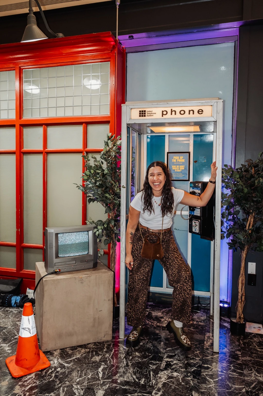 Visitor participating at a repurposed phone booth