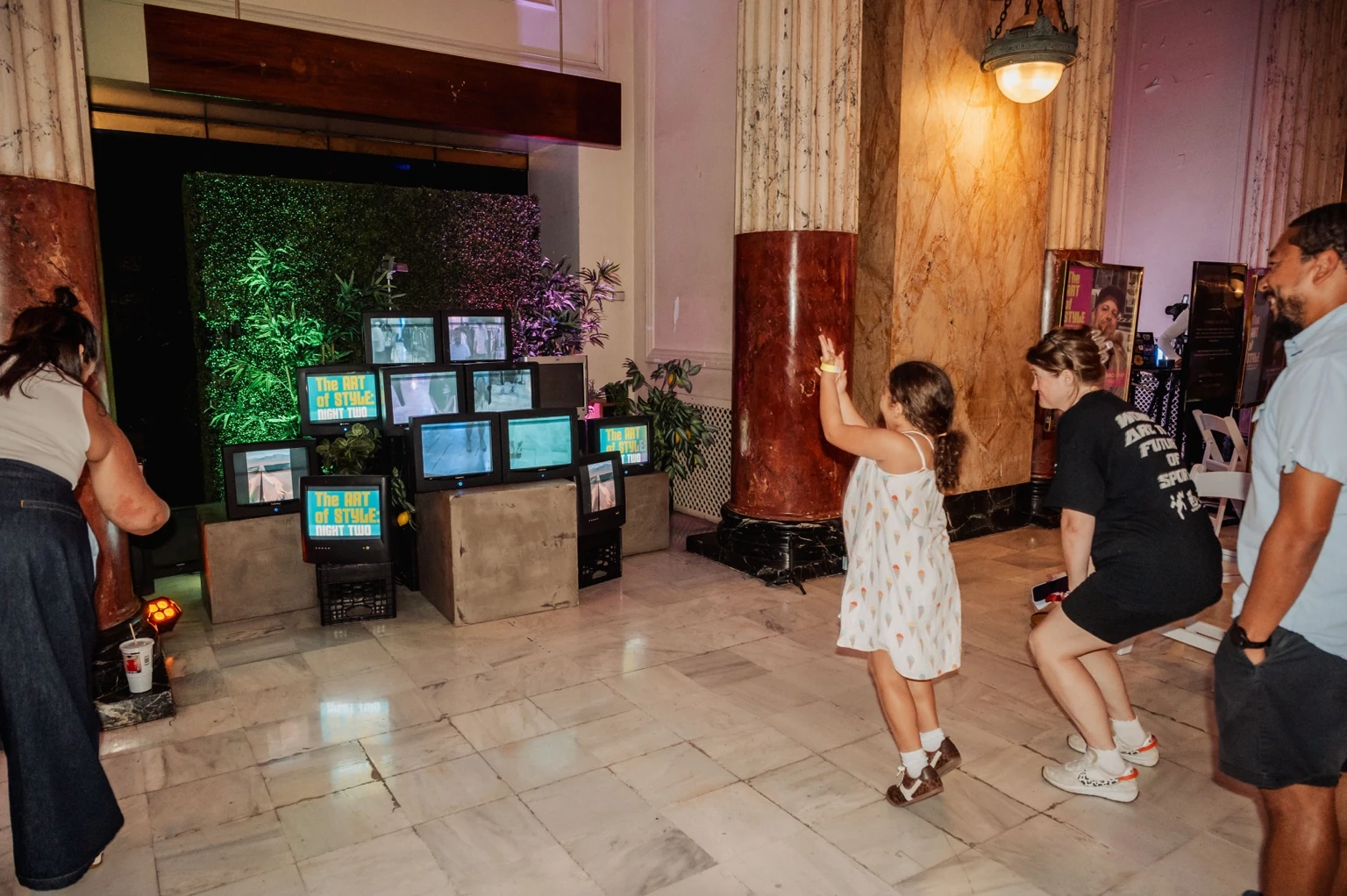 Guests experiencing a live CRT media installation at Union Station